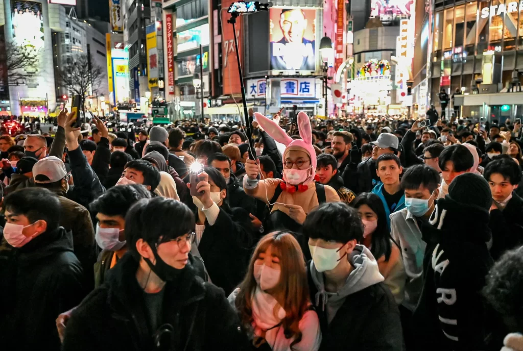 People try to cross the street shortly before midnight for New Year's celebrations in the Shibuya area of Tokyo.
Richard A. Brooks/AFP via Getty Images