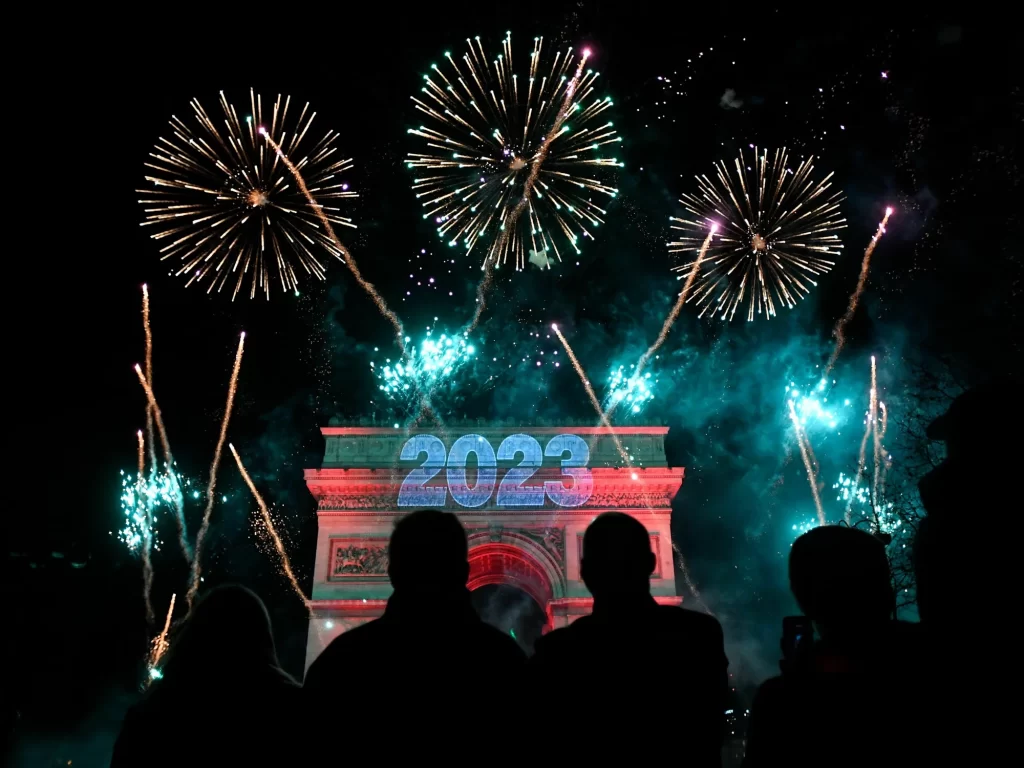 Fireworks explode next to the Arc de Triomphe with "2023" projected on the building, at the Avenue des Champs-Elysees during New Year celebrations in Paris.
Julien De Rosa/AFP via Getty Images