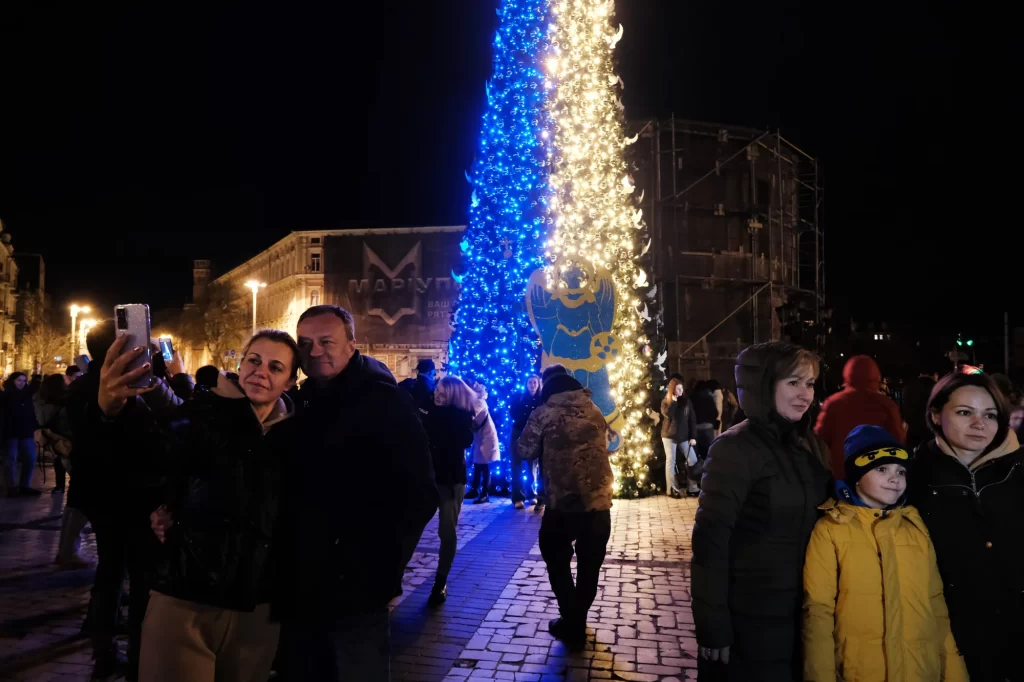 People gather near a Christmas tree decorated in the colors of the Ukrainian flag in a Kyiv square on New Year's Eve. Many residents are without power or water as the Russian missile assault continues throughout the country.
Spencer Platt/Getty Images