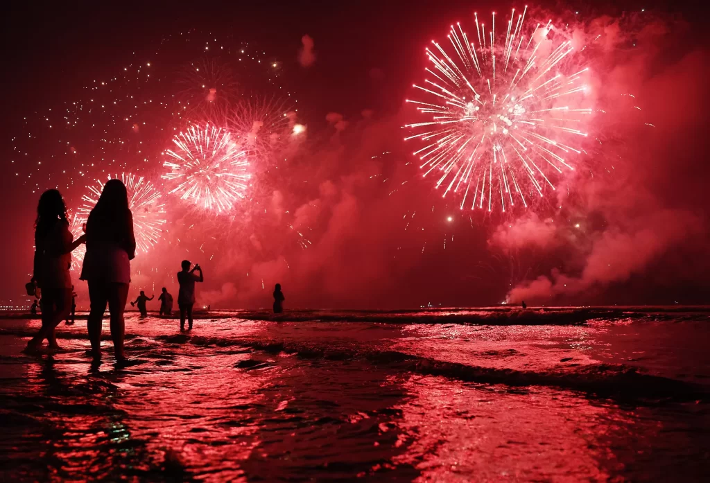 Brazilians celebrate during fireworks marking the start of the New Year at Gonzaga beach on Jan. 1, 2023 in Santos, Brazil.
Mario Tama/Getty Images
