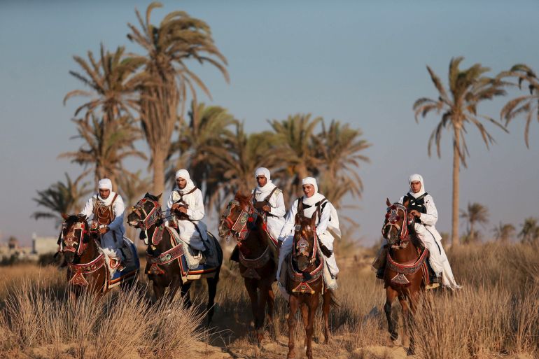 Horse riders, dressed in traditional costumes, mark Eid in Benghazi, Libya [Esam Omran al-Fetori/Reuters]
