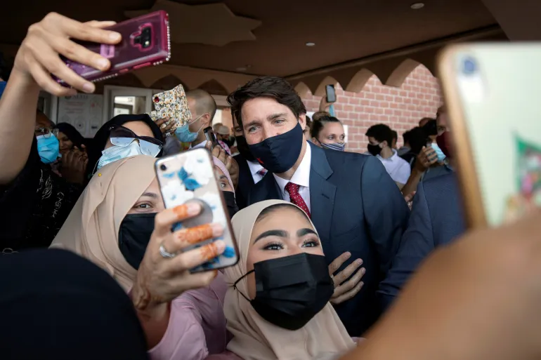 Canada’s Prime Minister Justin Trudeau visits the Hamilton Mountain Mosque at the start of Eid in Hamilton, Ontario, Canada [File: Nick Iwanyshyn/Reuters]
