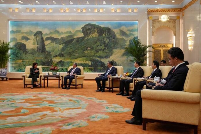 U.S. Commerce Secretary Gina Raimondo talks to Chinese Premier Li Qiang during a meeting at the Great Hall of the People in Beijing, China Tuesday, August 29, 2023. Andy Wong/Pool